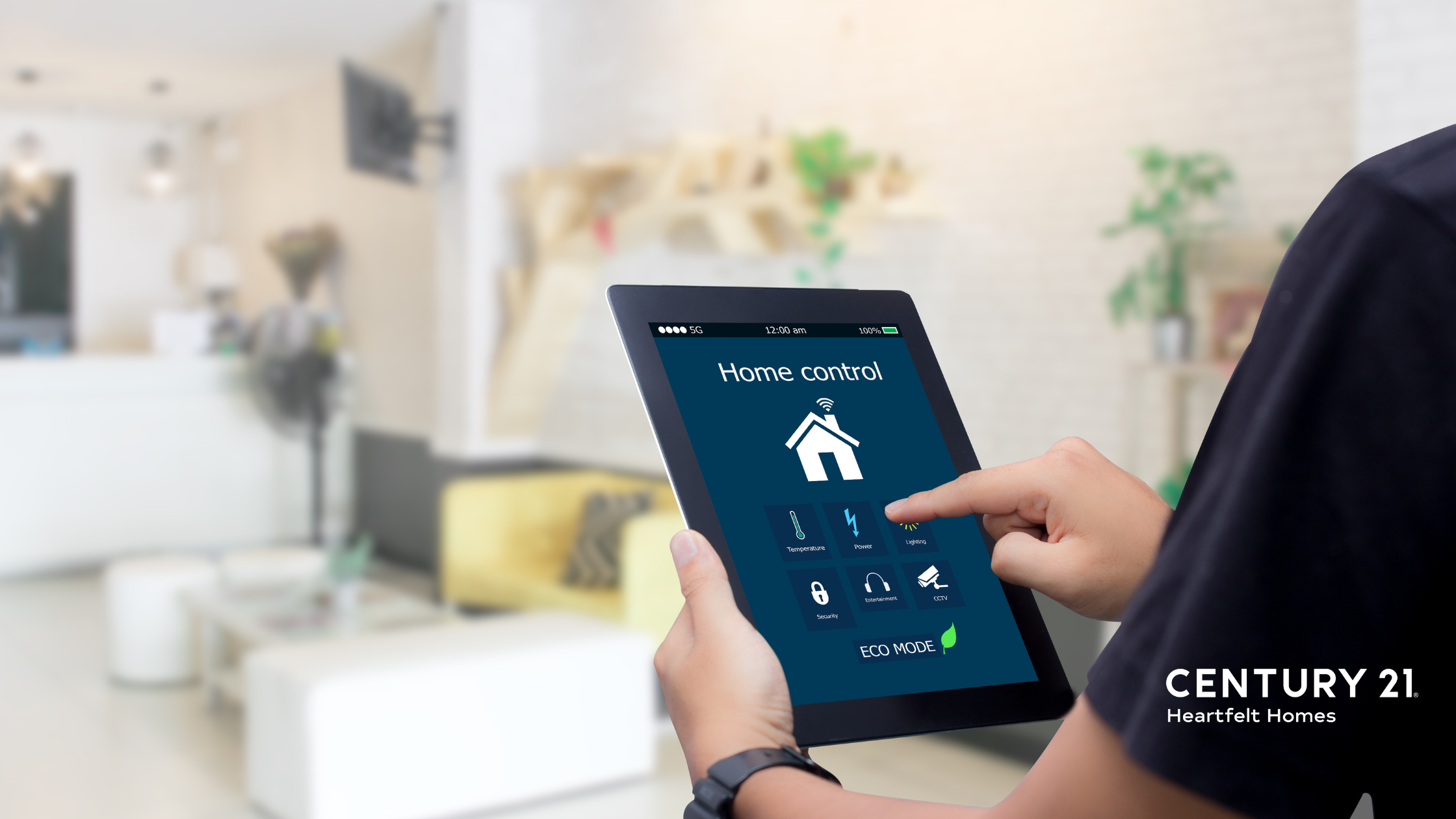 a man holding a tablet with functions for his smart home in a clean white living room